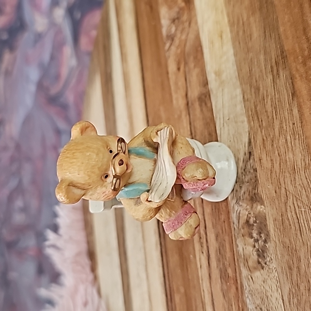 Boy teddy bear on toliet